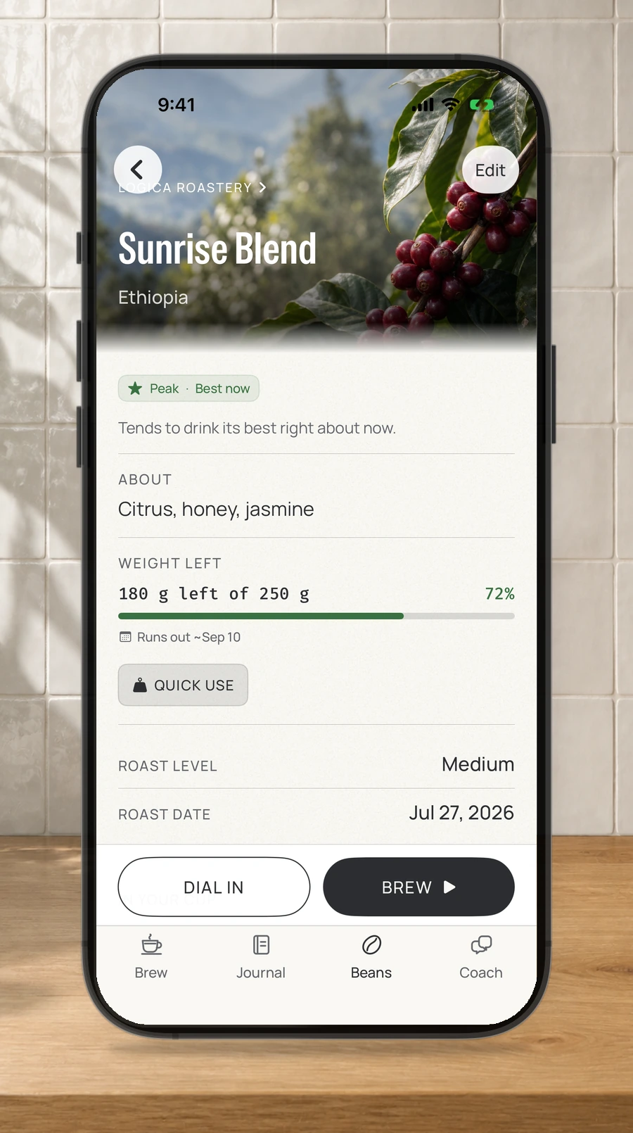 A straight iPhone showing a coffee bag's freshness stage, tasting notes, and remaining weight.